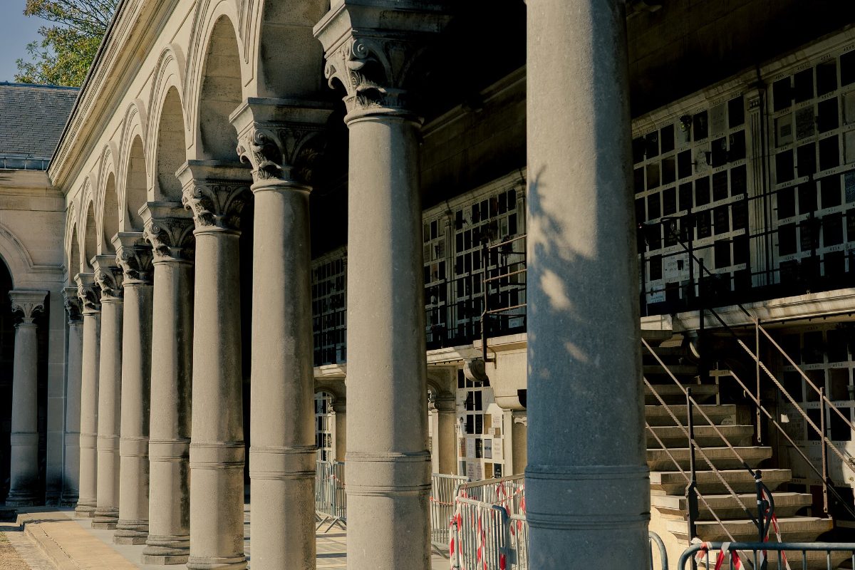 The colonnade of the columbarium, ranks of glazed niches behind stone columns